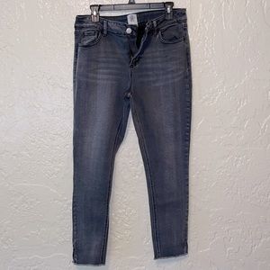 Dark grey stretchy skinny jeans, size 29, split/raveled hem